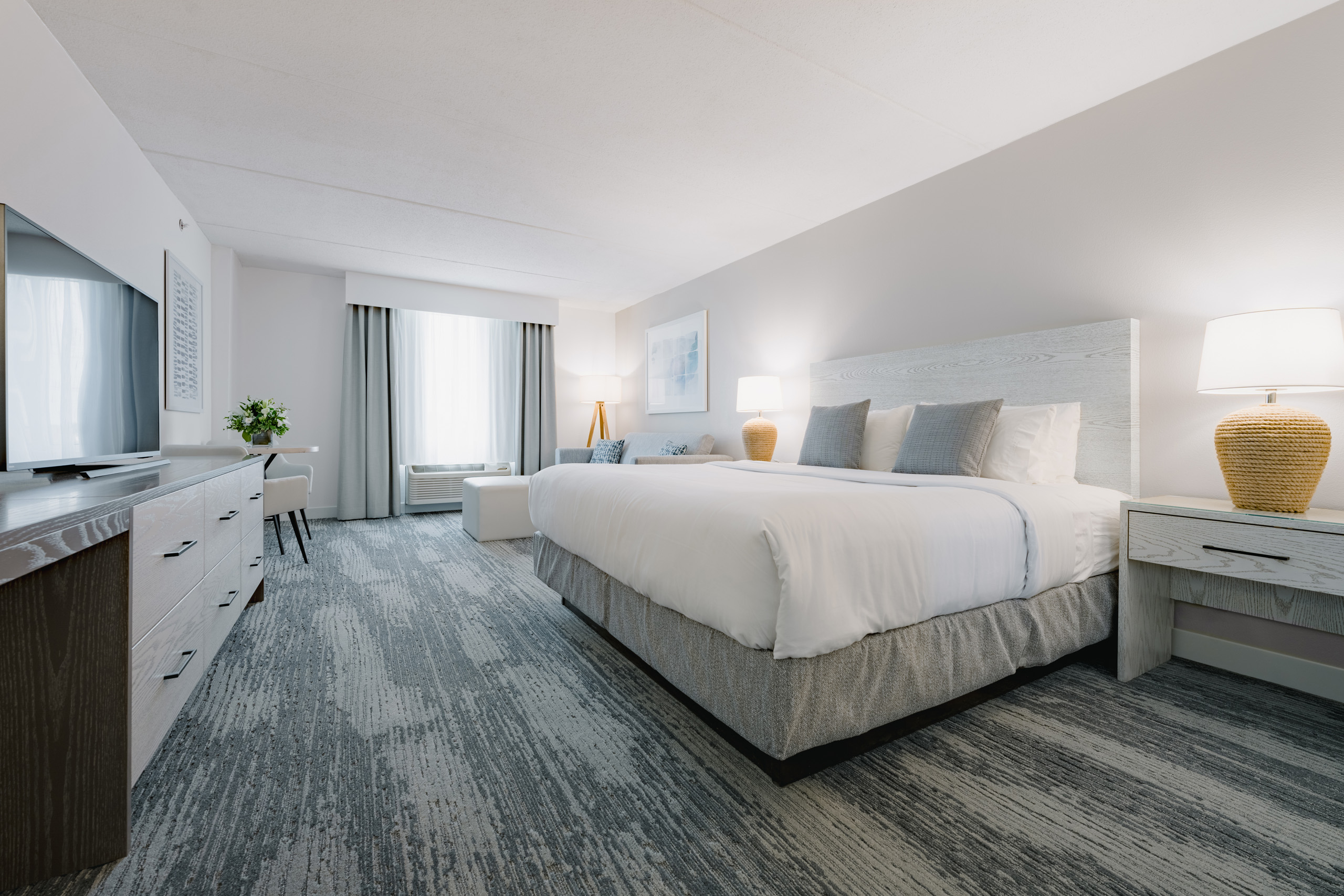 a modern, well-lit hotel room designed in a contemporary style